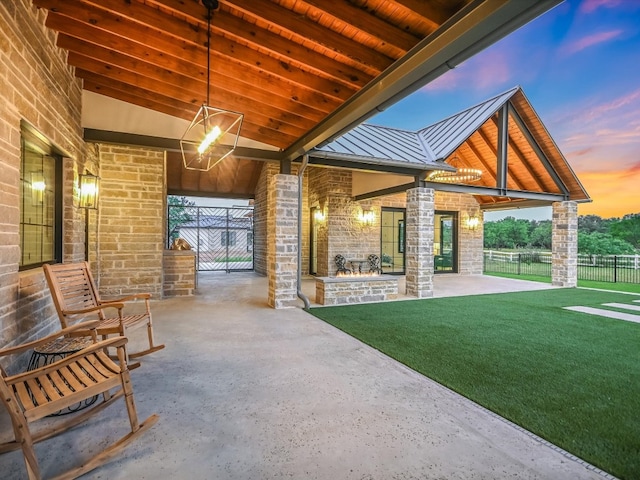 patio terrace at dusk with a yard