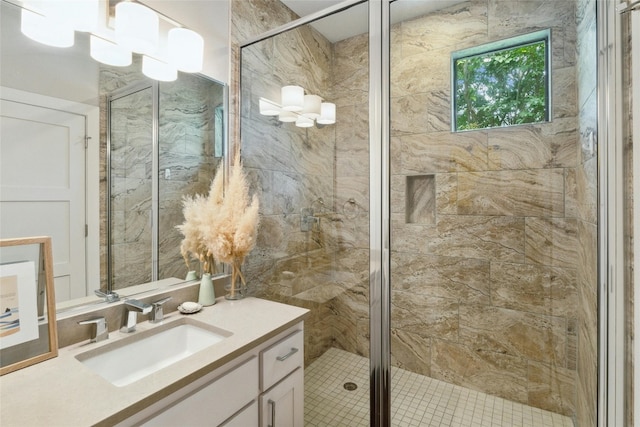 bathroom featuring an enclosed shower and vanity