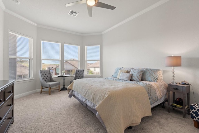 carpeted bedroom featuring ornamental molding and ceiling fan