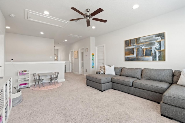 carpeted living room featuring ceiling fan