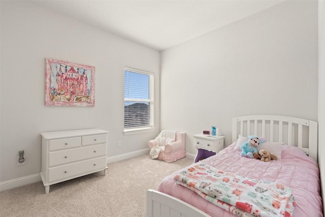 bedroom featuring light colored carpet