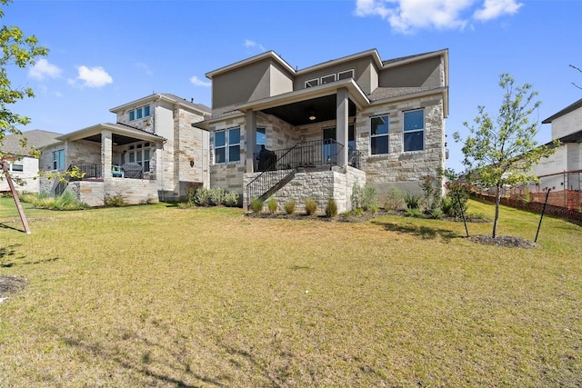 rear view of property with a yard