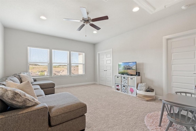 living room with light carpet and ceiling fan