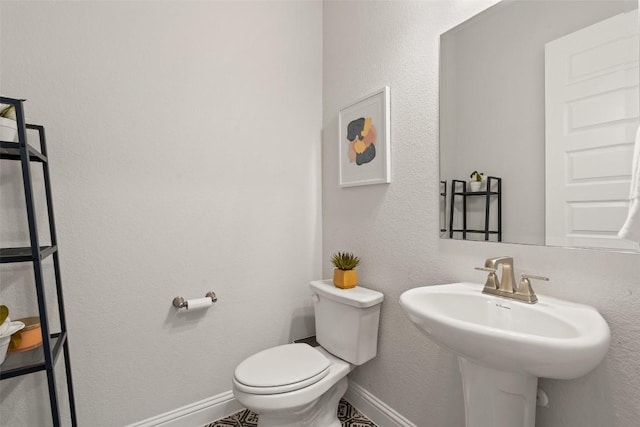 bathroom with sink and toilet