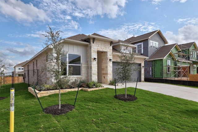 view of front facade with a garage and a front lawn