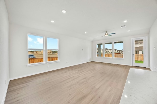 unfurnished living room with ceiling fan and light hardwood / wood-style flooring