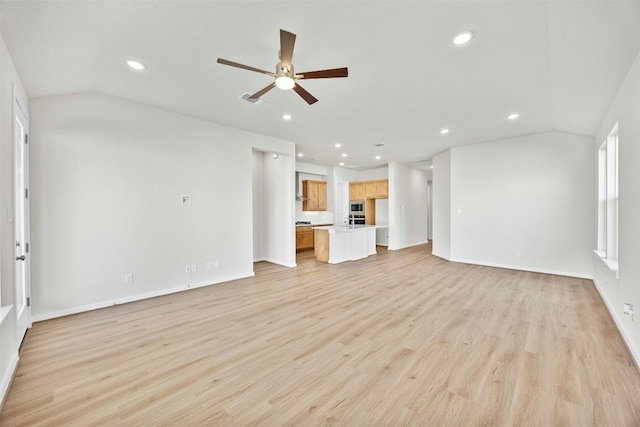 unfurnished living room with light hardwood / wood-style flooring, ceiling fan, and lofted ceiling