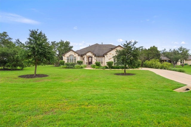 french provincial home with a front yard