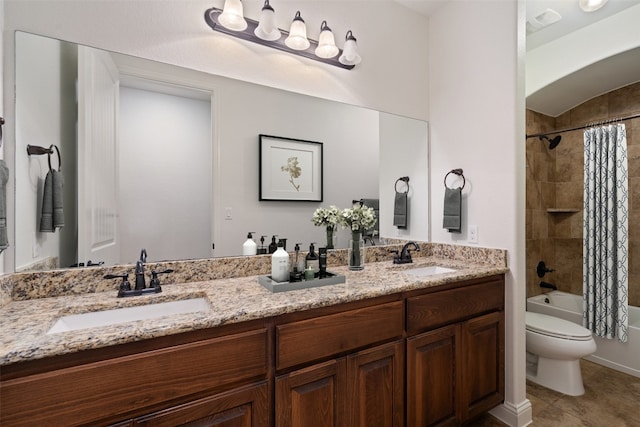 full bathroom with shower / bath combo, vanity, and toilet