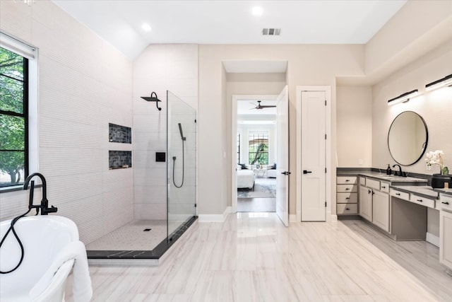 bathroom with tile floors, a shower with door, ceiling fan, and large vanity