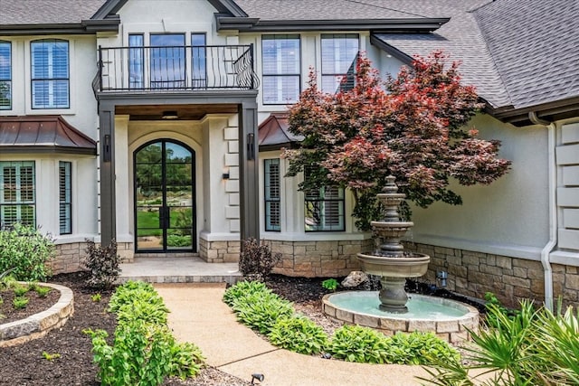 entrance to property with a balcony