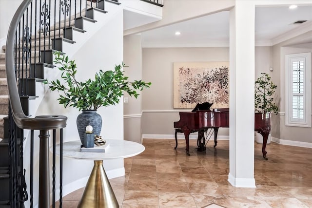 tiled entrance foyer with crown molding