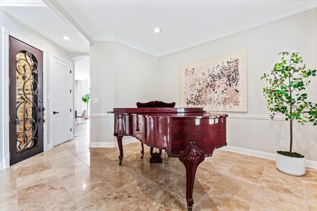 tiled entryway featuring crown molding