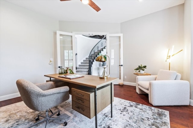 home office featuring dark hardwood / wood-style floors and ceiling fan