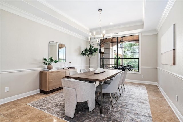 tiled dining area featuring a notable chandelier, ornamental molding, and a raised ceiling