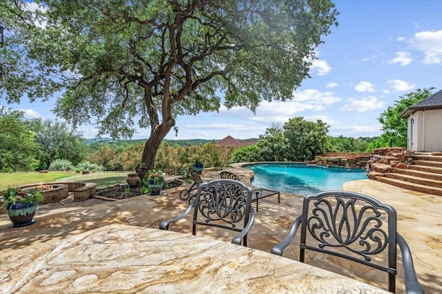 view of swimming pool with a patio area