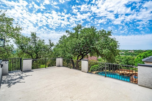 view of patio with a fenced in pool