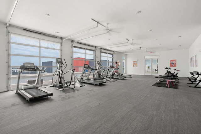 gym featuring carpet and ceiling fan