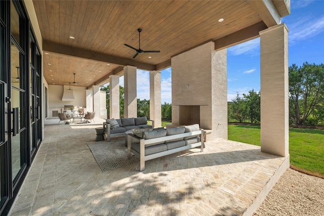 view of patio featuring ceiling fan, outdoor dining area, and an outdoor living space