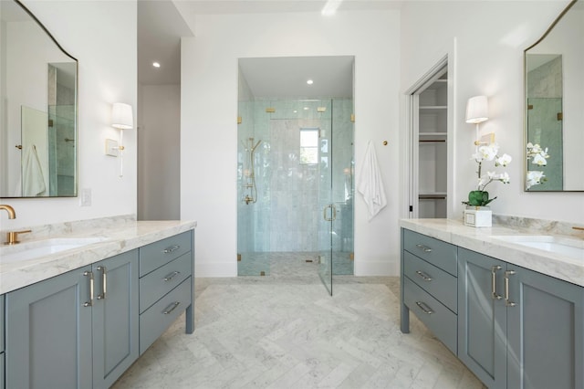 full bathroom with two vanities, a sink, and a shower stall