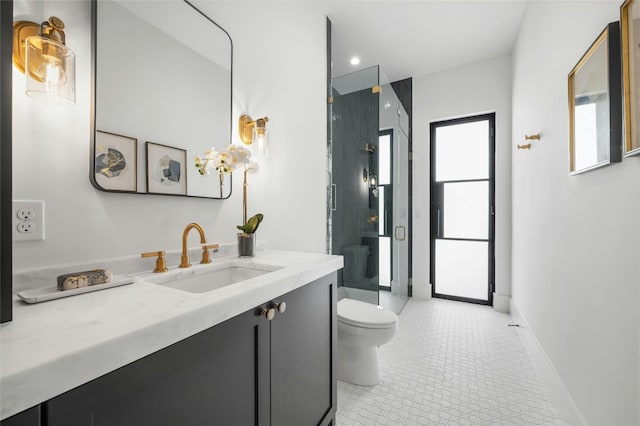 bathroom featuring baseboards, toilet, tile patterned flooring, vanity, and a shower stall