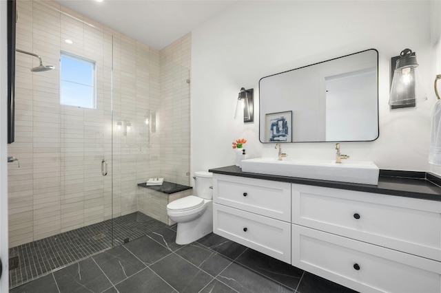 full bathroom featuring tile patterned flooring, a shower stall, toilet, and vanity