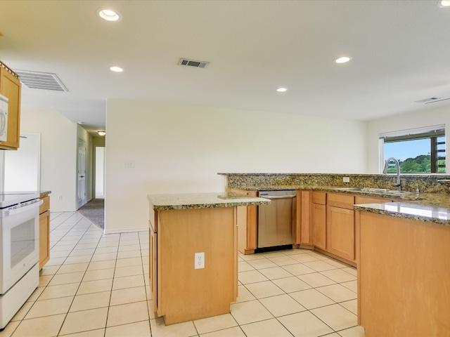 kitchen with stone counters, range, light tile floors, and stainless steel dishwasher