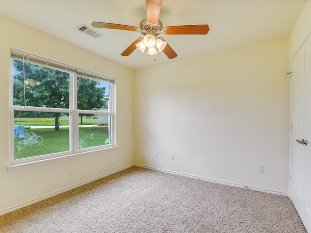 spare room with ceiling fan and carpet floors