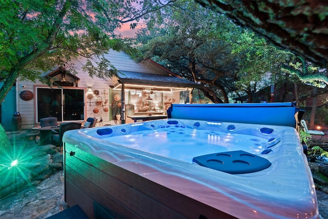 exterior space with a hot tub