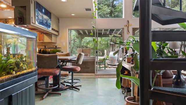 dining area featuring concrete floors