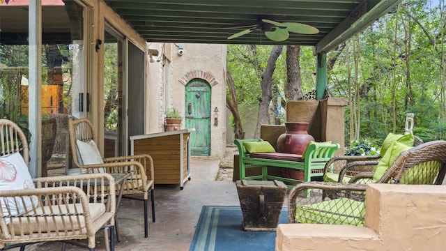 view of terrace featuring an outdoor living space and ceiling fan