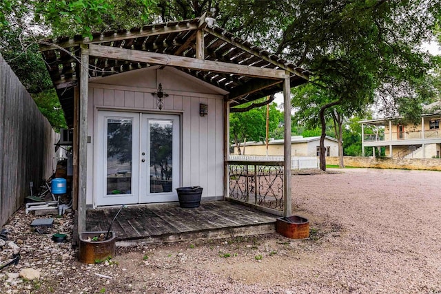 doorway to property featuring a deck and french doors