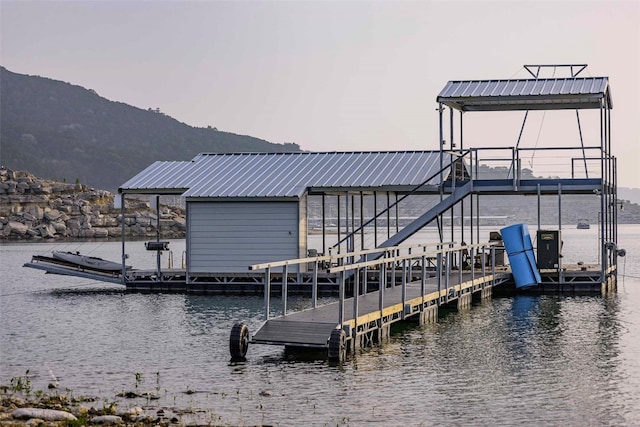 dock area featuring a water and mountain view