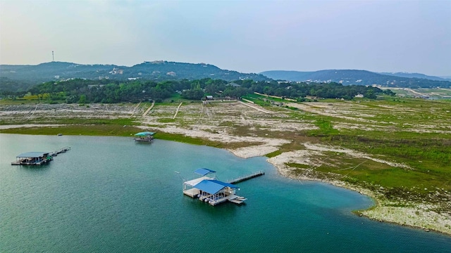 aerial view featuring a water and mountain view