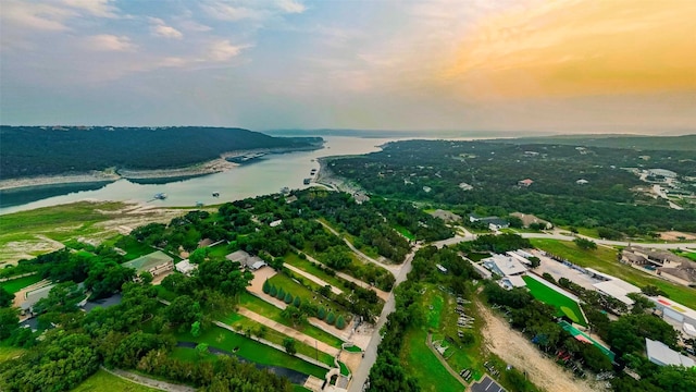 aerial view at dusk with a water view