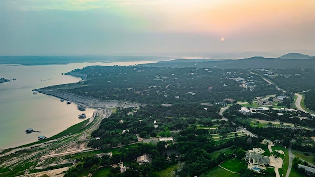 aerial view at dusk with a water and mountain view