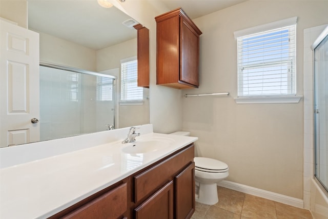 full bathroom with tile floors, shower / bath combination with glass door, toilet, and vanity