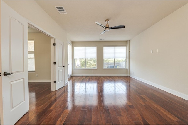 unfurnished room featuring ceiling fan and dark hardwood / wood-style flooring