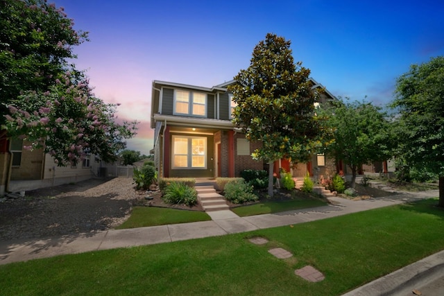 view of front of home featuring a yard