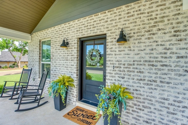 doorway to property featuring covered porch