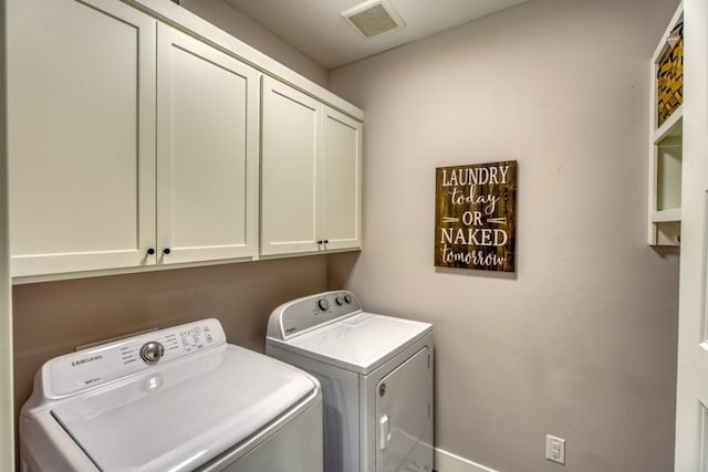 laundry area with cabinets and independent washer and dryer