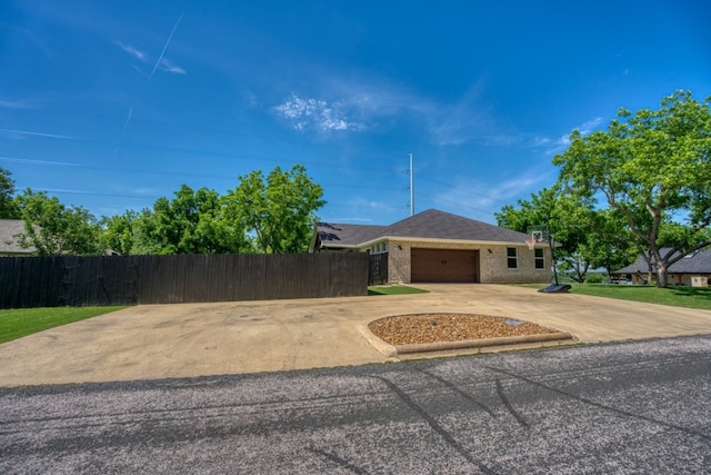 single story home with a garage