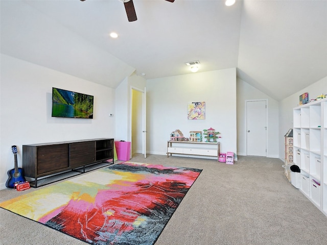 recreation room featuring ceiling fan, vaulted ceiling, and carpet floors