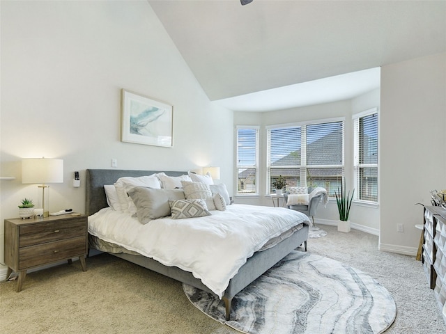 carpeted bedroom with vaulted ceiling