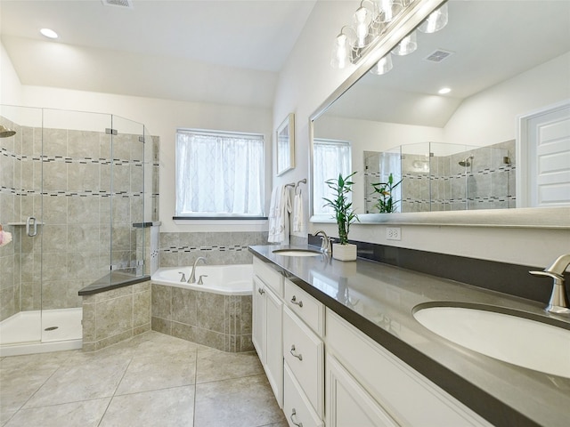 bathroom featuring vanity, lofted ceiling, shower with separate bathtub, and tile patterned flooring