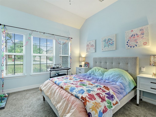 carpeted bedroom with lofted ceiling