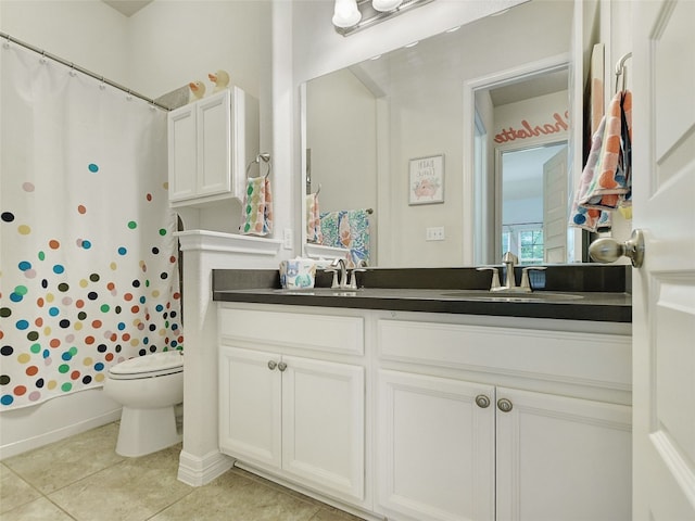 bathroom with vanity, a shower with curtain, toilet, and tile patterned flooring