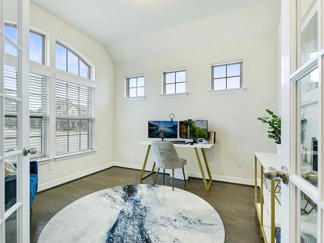 office area featuring lofted ceiling, dark wood-type flooring, and french doors