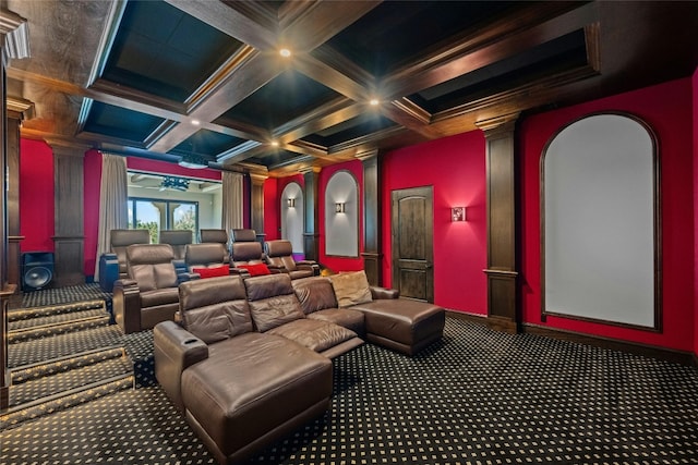 carpeted home theater room featuring crown molding, ornate columns, beamed ceiling, and coffered ceiling