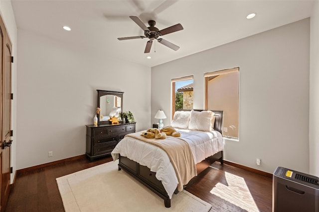 bedroom featuring ceiling fan and dark hardwood / wood-style flooring